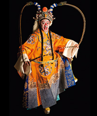 A person mid-dance in traditional Chinese costume.