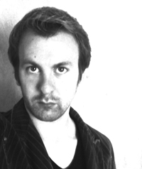 black and white photo of man looking serious