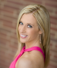 blond woman leaning against wall