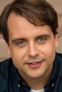 man with brown hair and green eyes