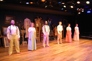 actors lined up and facing the audience
