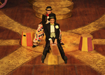 two actors dressed in suit sitting on a wooden plank
