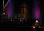a dimly lit room onstage