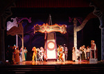 actors moving around a carousel