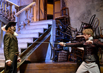 an actor holding a sword at another actor's chest