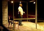 actor looking out from his porch at night