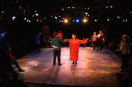 an actor presenting themselves for another actor who is talking to them, two actors are watching in the distance