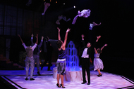 actors dancing, their arms are thrown up