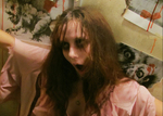 an actor with sunken eyes and pale, zombie-like
