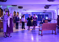 actors standing around worrying on a set