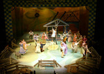 actors all dancing in a circle