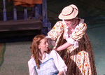 an actress holding onto the back of another actress