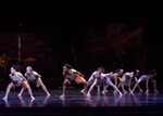 dancers bent over with their legs spread