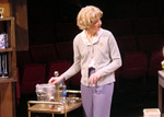 an actor is grabbing something from a cart
