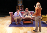 two actors sitting down in chairs while a third actor is lecturing them