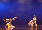 two sets of dancers, one is holding their partner up while the other holds their partner against their body