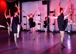 dancers standing in a circle formation and posing differently