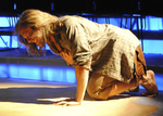 actor fallen to the ground while grabbing their chest