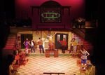 actors lined up on the perimeter of the stage
