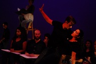 two actors dancing, one of them is being dipped and actors are watching their performance