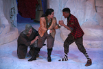 two actors holding fists up to one another, a third actor is holding on to the pants on one of them