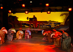 actors bowing while wearing Asian dresses and holding fans
