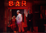 actors hanging out at a dimly lit bar
