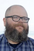 Portrait of someone with glasses.