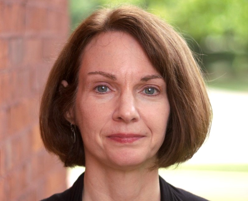 headshot os a woman with short brown hair.