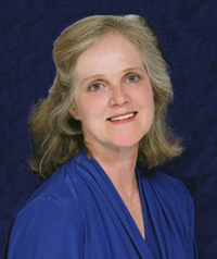 woman with blonde hair in blue shirt