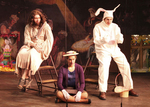 two actors sitting on the left and right, dressed as Jesus and the Easter bunny, with an actor sitting on the ground in the center