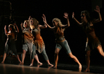 dancers leaning forward on an invisible wall