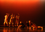 three dancers standing in the back with multiple dancers on the ground in front of them