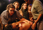 actors hovering over a CPR doll
